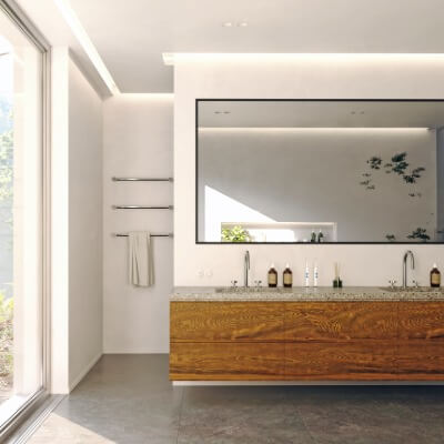 Walk in shower behind bathroom sink and vanity