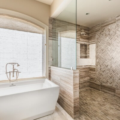 Bathtub next to walk in shower
