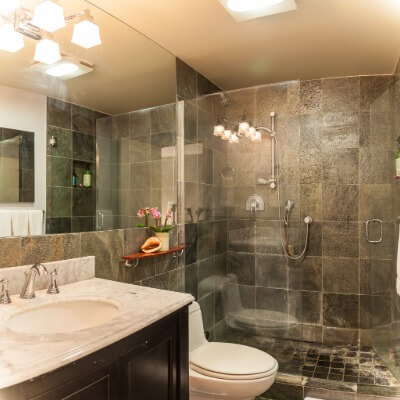 Small bathroom remodel with brown tile